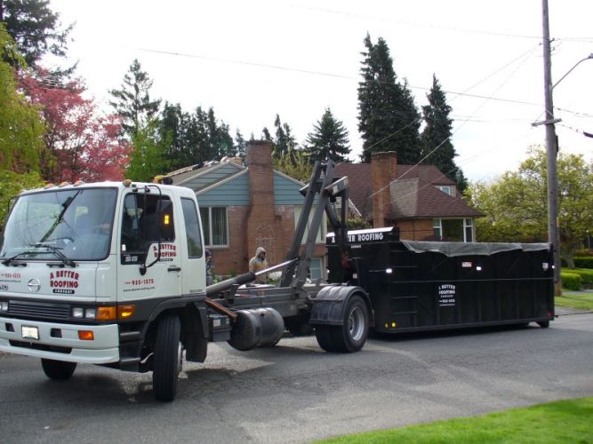 A Better Roofing Company Dumpster Trucks