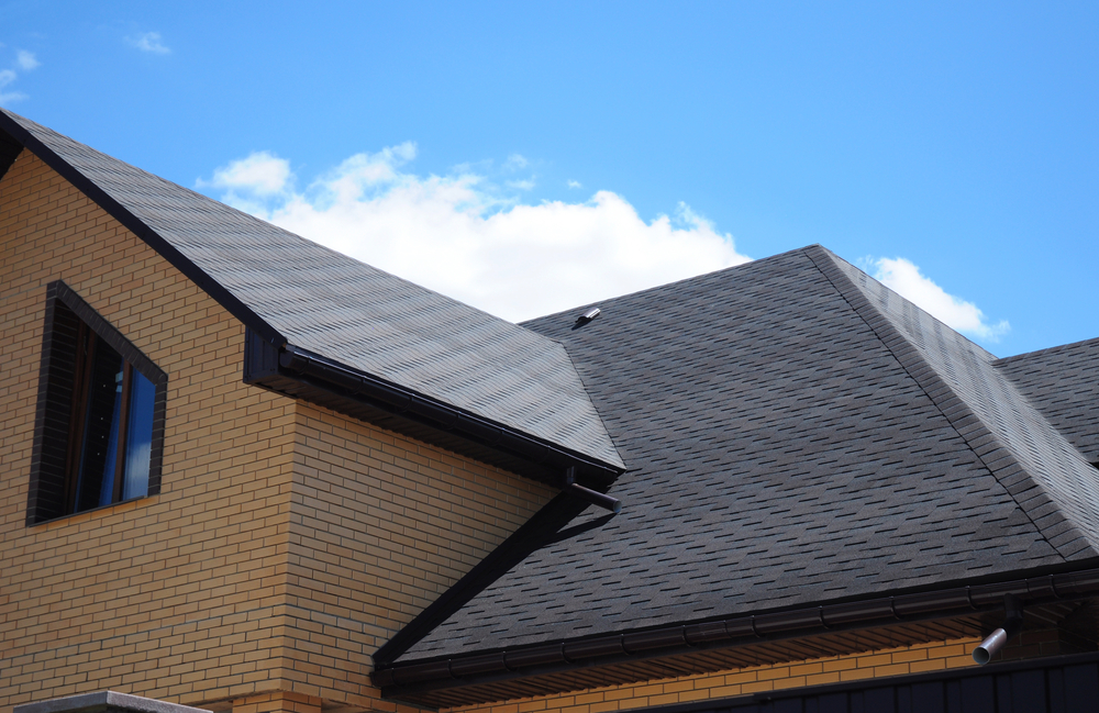 Home with dark grey asphalt shingle roof